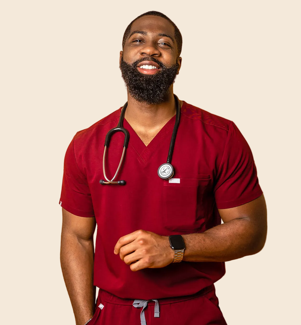 Dr. Terry wearing red medical scrubs with a stethoscope.